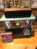 The music in the shop couldn't come from anything other than a turntable. Spin the Black Circle.